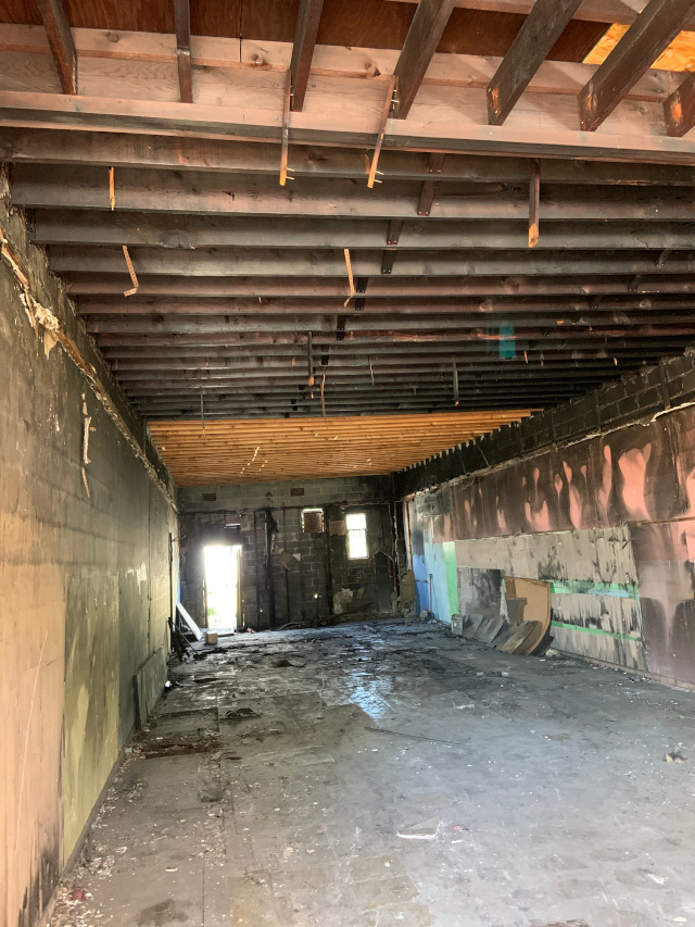 Gutted, post-fire retail space