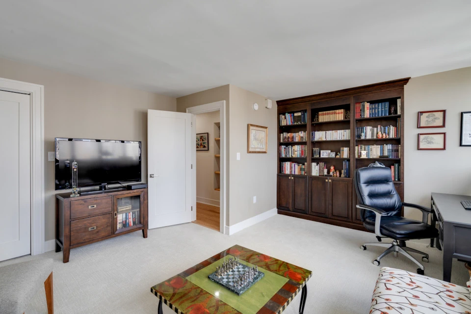 Built in dark wood cabinets. Elegant crown molding. 