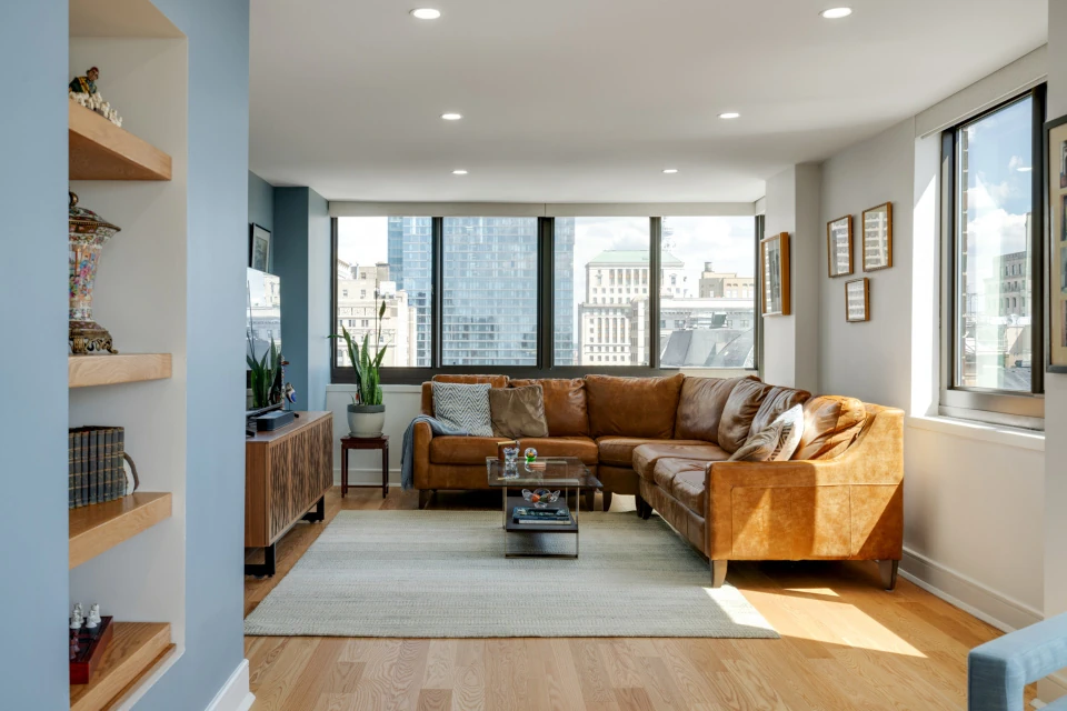 Living Room with Recessed lighting, Built in wooden shelving.