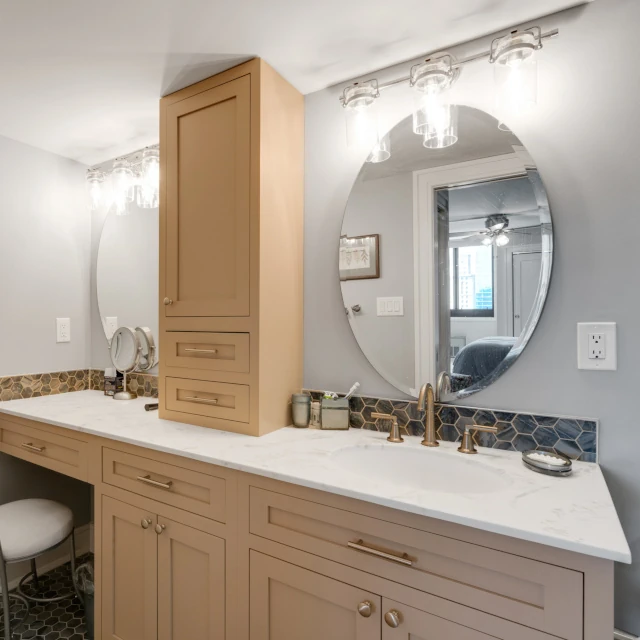 Custom cabinets to maximize space with Sit-in vanity. 
