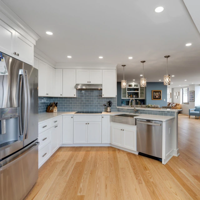 Flooring. Custom laminate wood flooring throughout remodeled space.