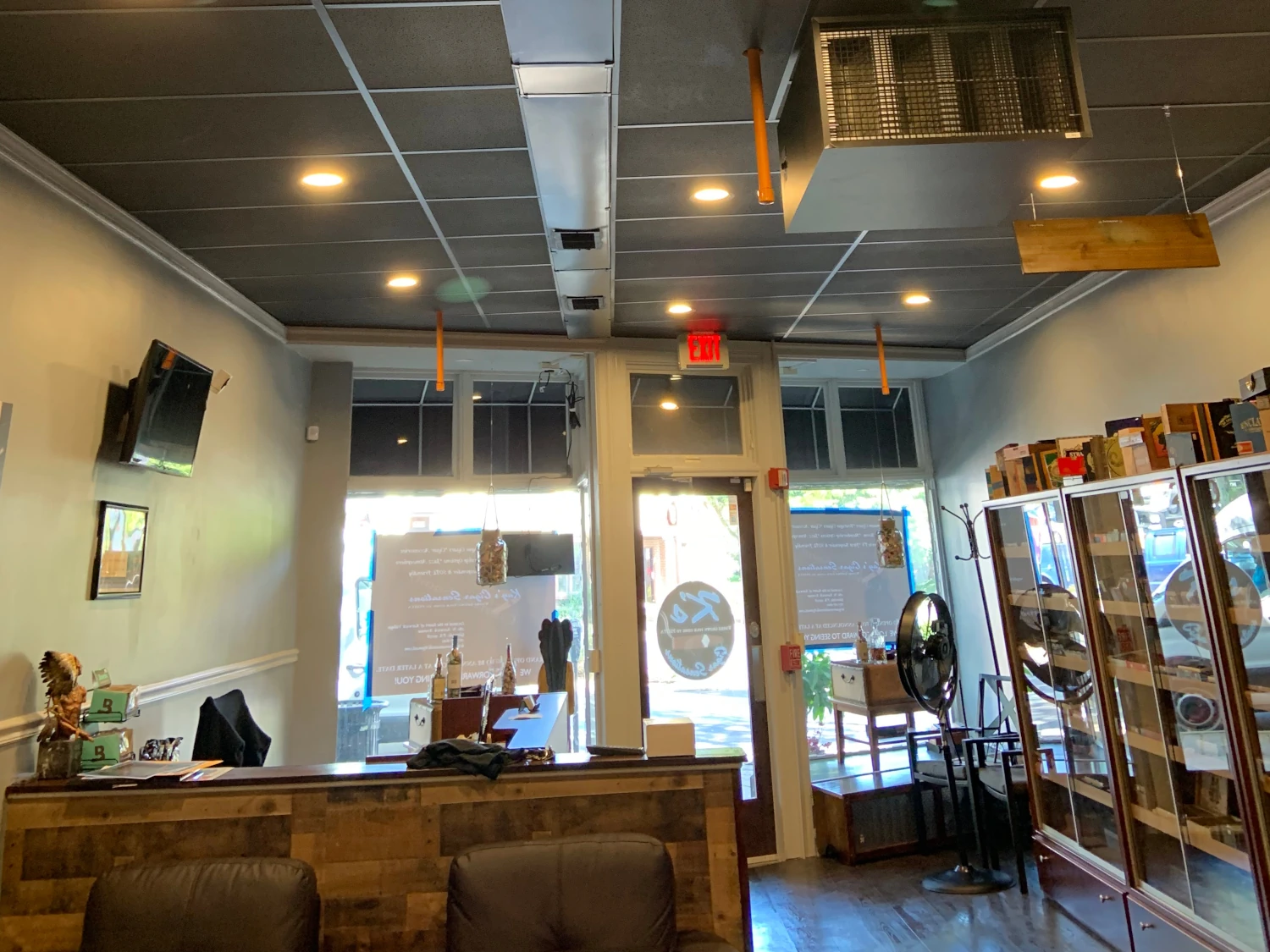 Retail entryway with stylish merchandise displays, and host area.  
